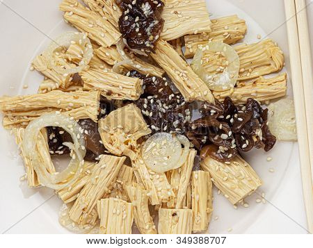 Close-up Spicy Chinese Or Korean Yuba Tofu Bamboo And Oyster Mushrooms On Wooden Background.