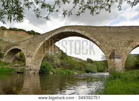 Photographs Of The Arched Historic Bridge Made Of Stone