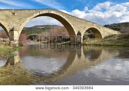 Photographs Of The Arched Historic Bridge Made Of Stone