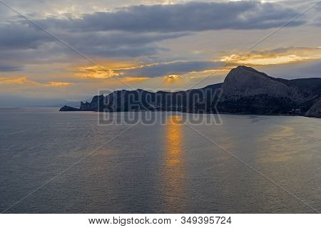 Sunset On The Black Sea Coast Of Crimea. View From The Top Of Cape Alchak To The West, Towards Novyy