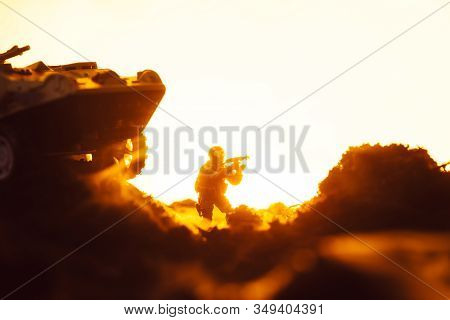 Battle Scene With Toy Soldier Near Tank On Battleground On Yellow Background