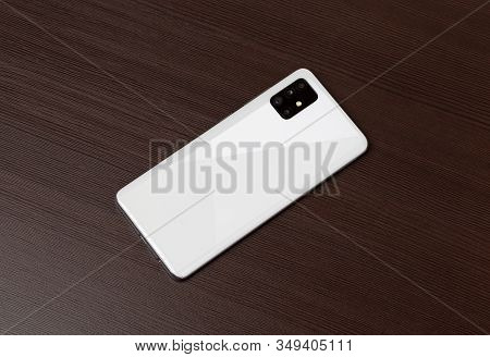 Rostov-on-don, Russia - January 2020. Samsung Galaxy A51 On A Wooden Background. Smartphone On Woode