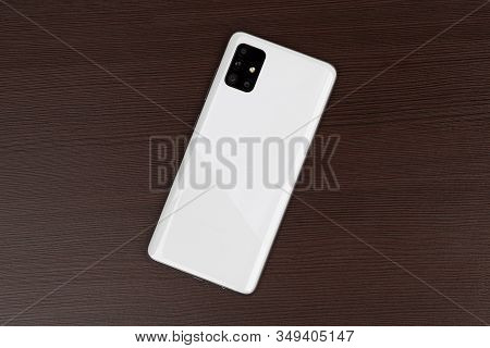Rostov-on-don, Russia - January 2020. Samsung Galaxy A51 On A Wooden Background. Smartphone On Woode
