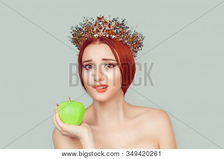 Beauty Queen Craving For Vitamins Sugars. Pretty Woman With Crystal Crown On Head Holding Green Appl