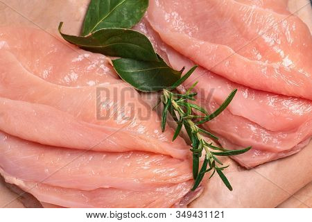 Raw sliced chicken meat close-up. Sotilissimo. Delicious dietary meat. Cooking,food of meat and fillets.Close-up view of raw, fresh, choped and sliced chicken meat.Sottilissime