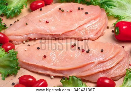 Raw sliced chicken meat close-up. Sotilissimo. Delicious dietary meat. Cooking,food of meat and fillets.Close-up view of raw, fresh, choped and sliced chicken meat.Sottilissime