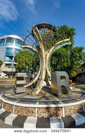 Manado, North Sulawesi, Indonesia - August 5, 2015: Monument Tugu Zero Point On The Traffic Roundabo