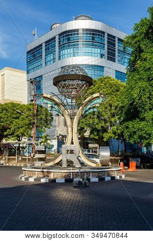 Manado, North Sulawesi, Indonesia - August 5, 2015: Monument Tugu Zero Point On The Traffic Roundabo