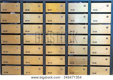 Metallic Letter Mailboxes At Postal Room In Condominium Building