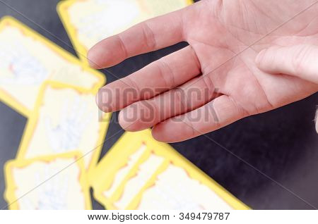 Chiromancer Reads The Lines On A Male Hand. Finger Indicates The Line Of The Mind. Close-up. Shootin