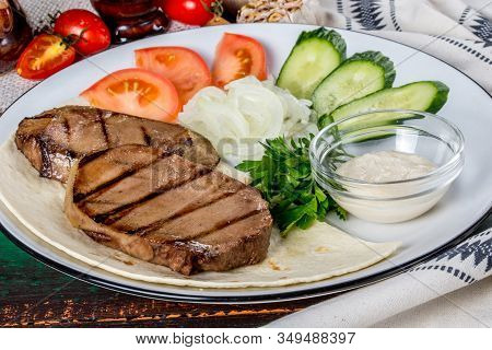 Cooked Veal Tongue With Fresh Vegetables. Shot In The Decor