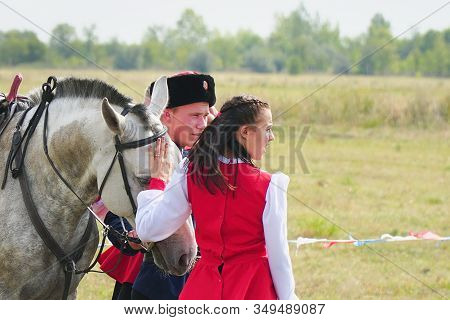 Samara , Russia - August 17, 2019: Young Cossack And Cossack Girl In National Costumes Standing Next