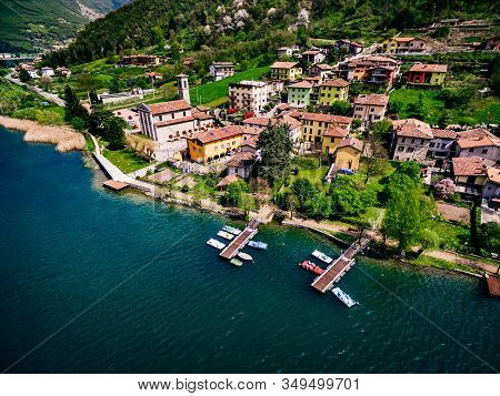 Aerial View Of Beautiful Spring Landscape With Italian Village By Turquoise Lake Endine, Italy