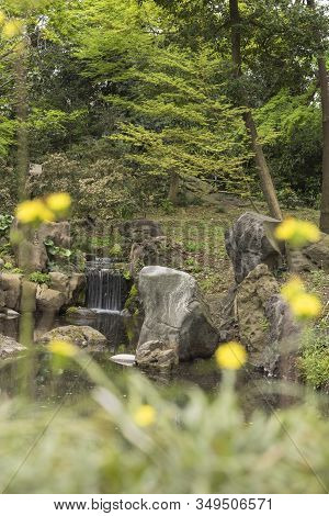 Takemi Teahouse Waterfall Seen From The Chidori Wooden Bridge Lined With Flowers Located In The Riku