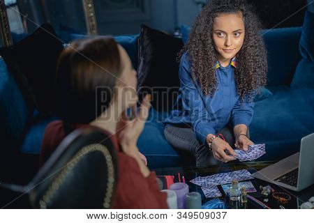 Beautiful Female Soothsayer Sitting At The Table