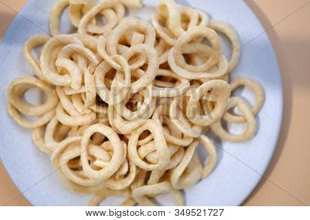 Beer Snack Dough Rings View From Above. Onion Rings In Breading. Salty Crispy Snacks On A Plate.