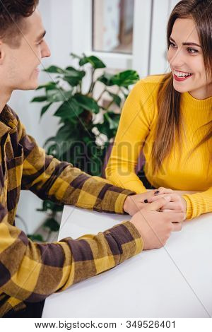 Cropped Shot Of Funny Boy And Girl Spending Time In Cafe, Joking And Laughing Desparately.