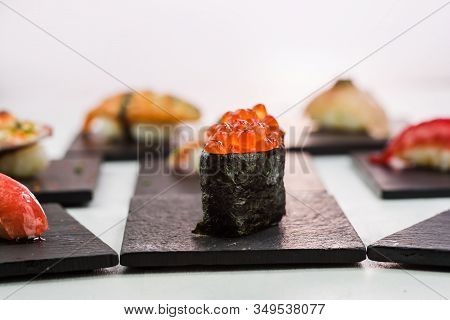 Close-up Of Ikura Gunkan Sushi On White Background