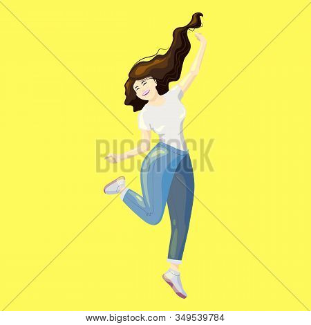 A Young Cheerful Woman. The Girl Jumps, Happily Throws Her Hands In Different Directions, One Leg Is