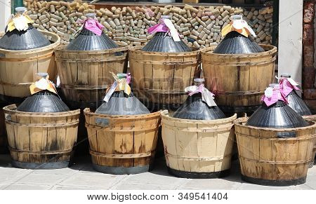 Eight Big Demijohns Also Called Carboys Full Of Wine