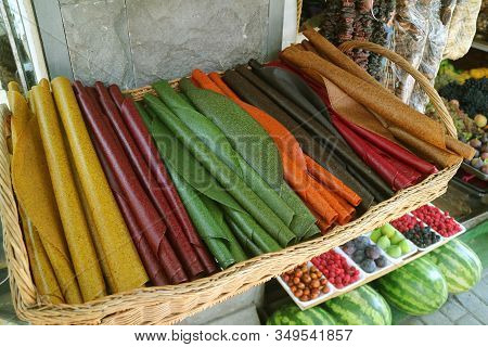 Basket Of Traditional Georgian Sun-dried Pureed Fruit Sheets Called Tklapi