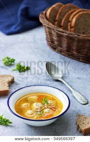 Dietary Soup With Meatballs, Potatoes And Noodles Served With Rye Bread With Bran. Childrens Menu.