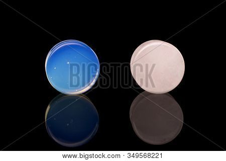 Group Of Two Whole Blue White Plug Isolated On Black Glass