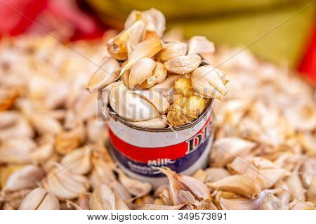 Cloves Of Garlic In Tin Can At A Local Fresh And Organic Market