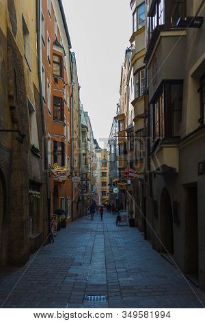 Insbruk, Austria - February 2020:pedestrians, Residents And Tourists In The Narrow Streets Of The Ol