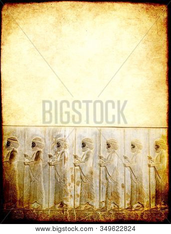 Vertical grunge background with paper texture and bas-relief with assyrian warriors with spears. Copy space for text. Mock up template