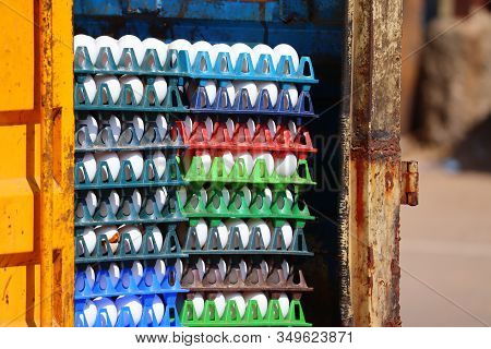 Close-up Of White Huns Egg On Red,green, Purple And Blue Tray On Street Market Place , Outdoors Stre