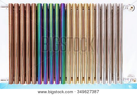 Heated Towel Rail Or Radiator From Multi-colored Chrome Pipes.
