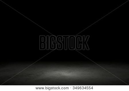 Light Shining Down On Black Marble Floor In Dark Room With Copy Space, Abstract Background