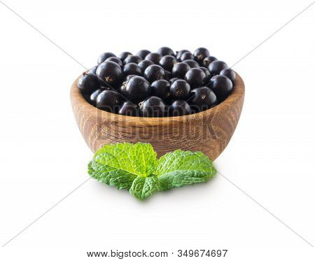 Black Berries Isolated. Blackcurrants In A Wooden Bowl Isolated On White Background. Blackcurrants W