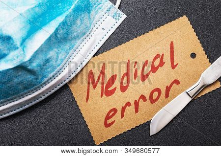 Mask, Scalpel And Sheet Of Paper With Text. Medical Error Concept