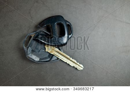Close Up Dirty Broken Or Damaged Car Remote Key On Black Background