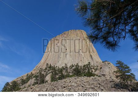 The Spectacular Vertical Rock Columns That Form Devils Tower National Monument In Wyoming Against A 