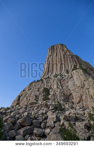 The Spectacular Vertical Rock Columns That Form Devils Tower National Monument In Wyoming Against A 
