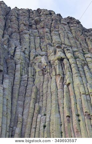 Unidentifiable People Use Rope And Gear To Climb The Spectacular Vertical Columns Of Devils Tower Na