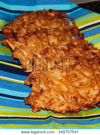 Potato Pancakes On A Blue Striped Background