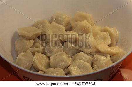 Homemade Dumplings In A White Bowl