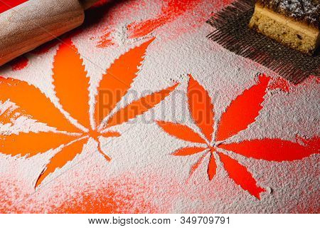 Cooking Cannabis Food. Trail Of Cannabis Leaf On White Flour On Lush Lava Color Table. Battledore. O