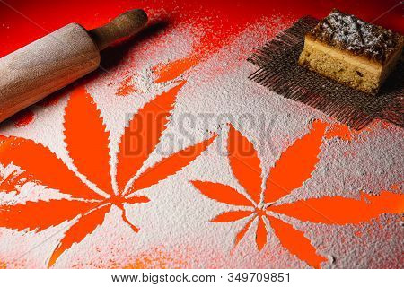 Cooking Cannabis Food. Trail Of Cannabis Leaf On White Flour On Lush Lava Color Table. Battledore. O