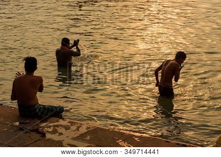 Kolkata, India - March 11, 2019: Indian People Bathing In River Hooghly Or Ganga At Mallick Ghat In 