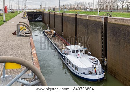 Maasbracht, The Netherlands - March 20, 2019: Big Barge In Lock Of Canal Julianakanaal Near River Me