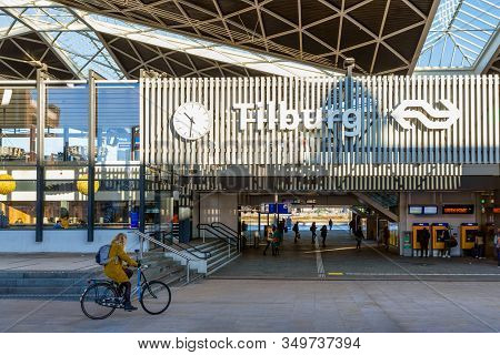 Tilburg, The Netherlands - December 04, 2019: Railway Station Tilburg With Passing Cyclist And Pedes
