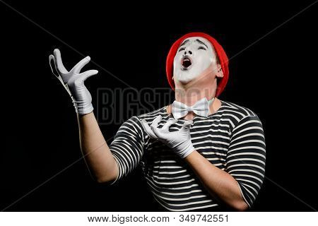 Male Mime Singing Opera, Looking Up And Gesturing With Hands