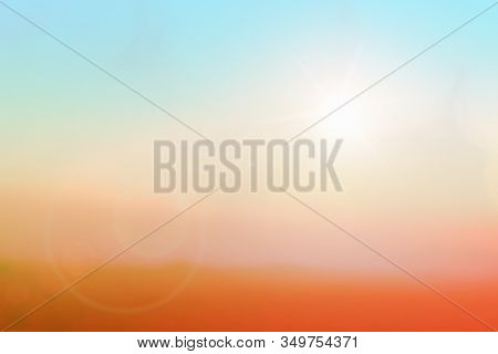 Natural Background Blurring Warm Colors And Bright Sunlight. Bokeh Or Christmas Background Blue Sun 