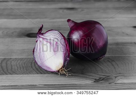 Large Juicy Red Onion Bulbs In Close-up On A Black And White Background