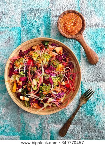 Fresh Salad Of Broccoli, Shredded Carrots, Apple, Red Cabbage, Beets, Radishes With Sesame Peanut Dr